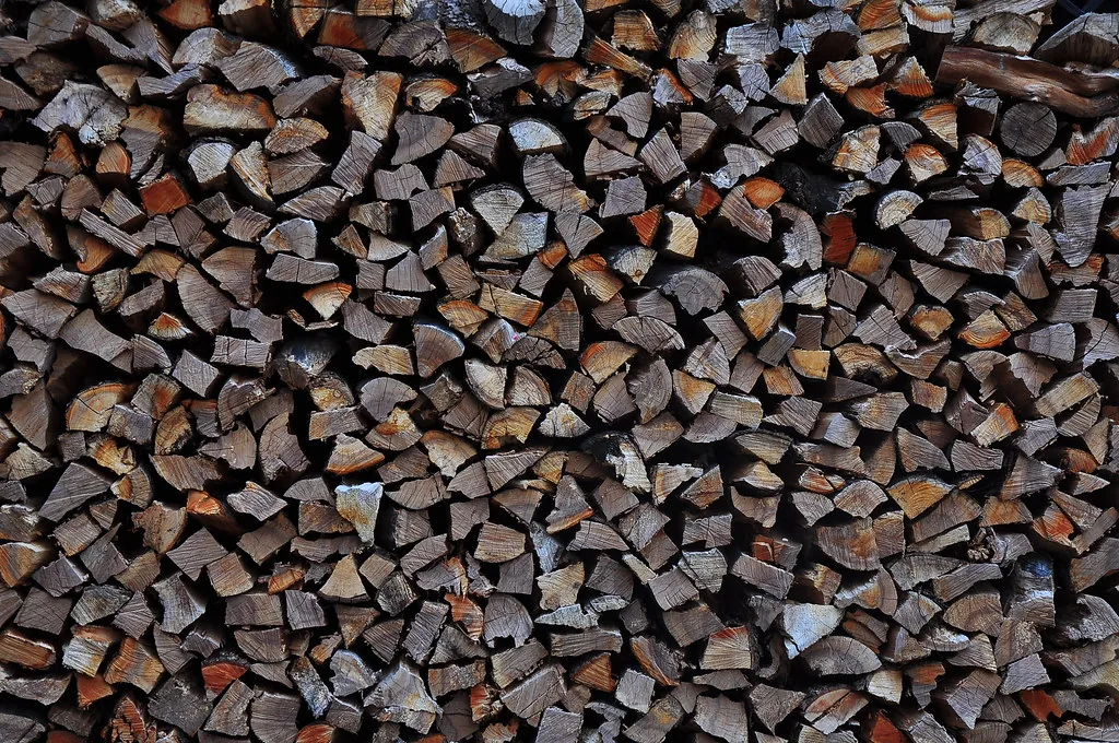 Stacked split firewood showing cut wood texture